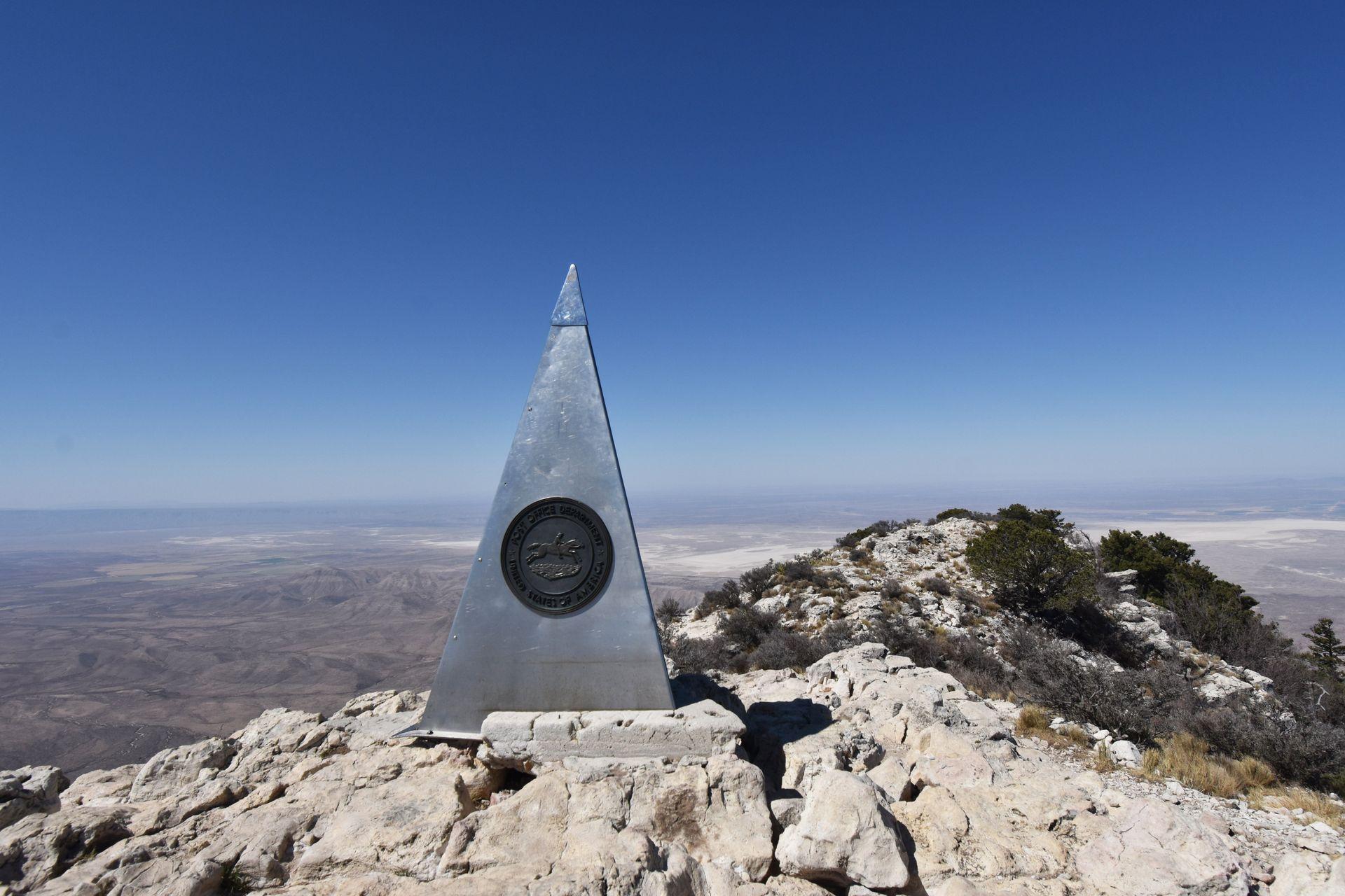 A large metal pyramid on the top of Guadalupe Peak at Guadalupe Mountains National Park.