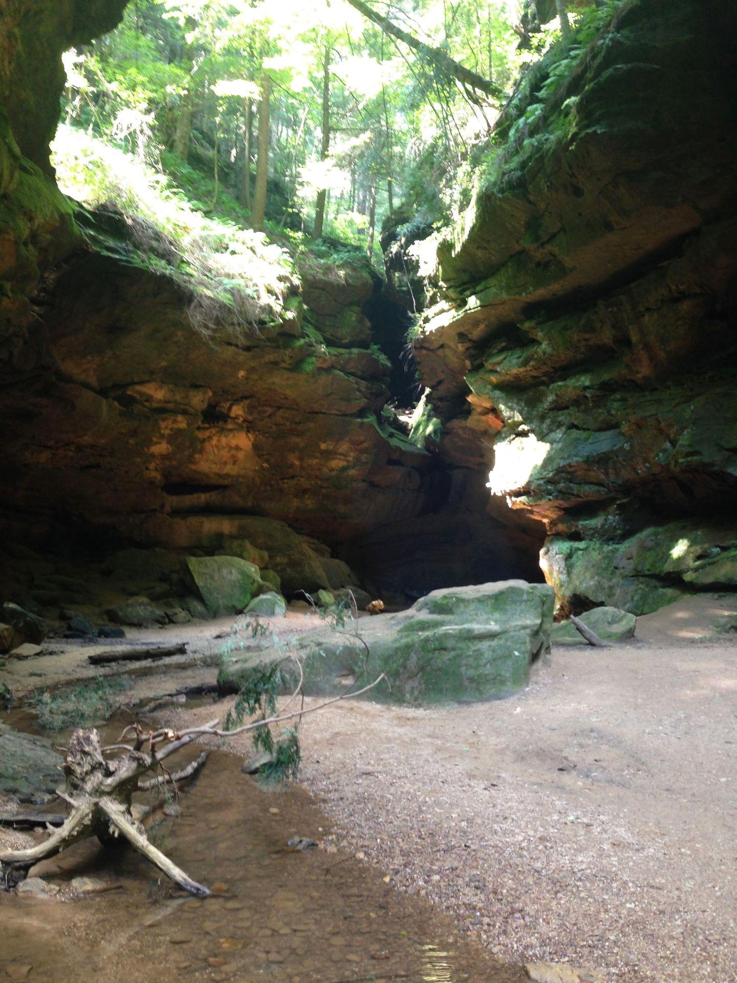 Hiking into a large grotto at Conkles Hollow State Nature Preserve