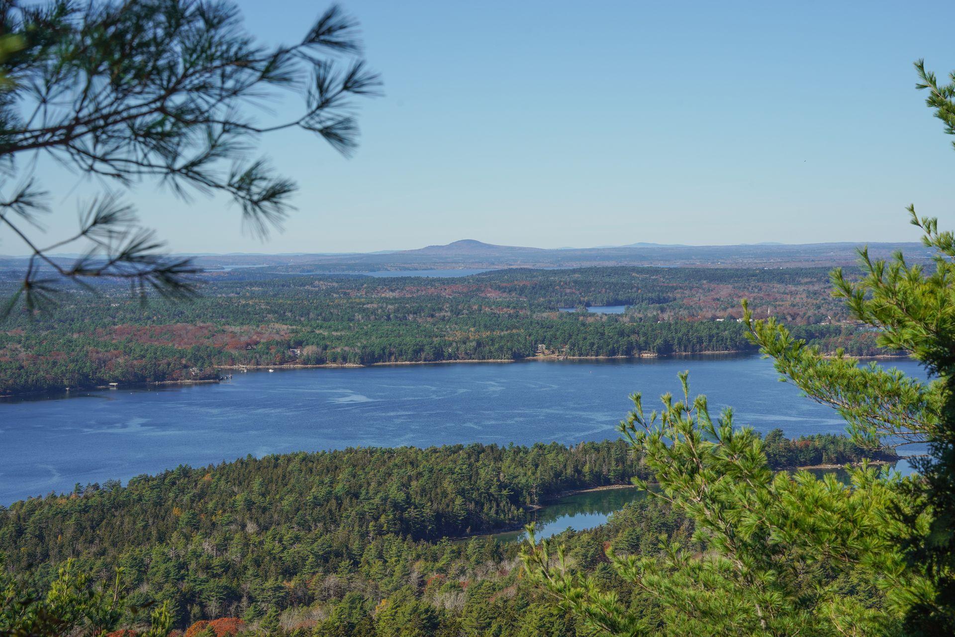 A few lakes surrounded by rolling hills and trees, seen from the Carriage Roads in Acadia.