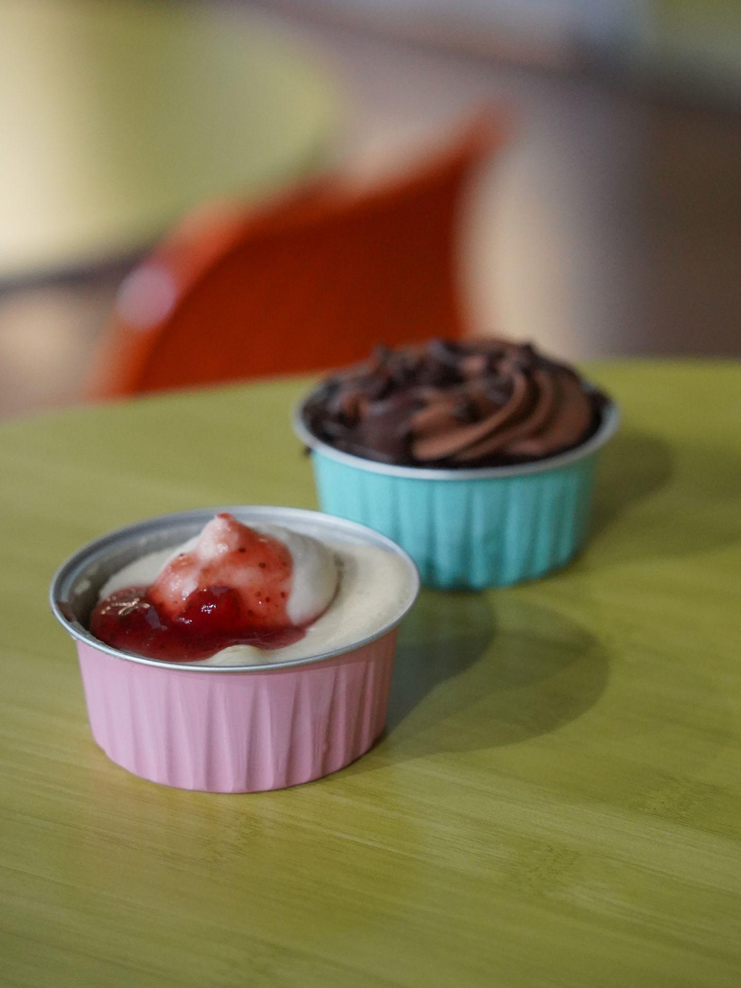 A mini chocolate cake and strawberry cheesecake inside the NewBo City Market