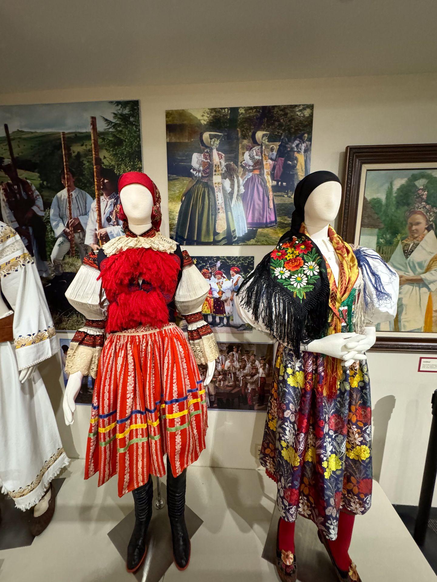 Two figures wearing colorful clothing at the National Czech & Slovak Museum & Library