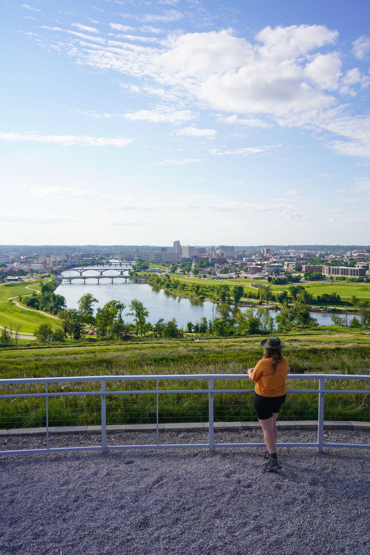 Lydia looking out at the view of downtown Cedar Rapids from the top of Mt. Trashmore.