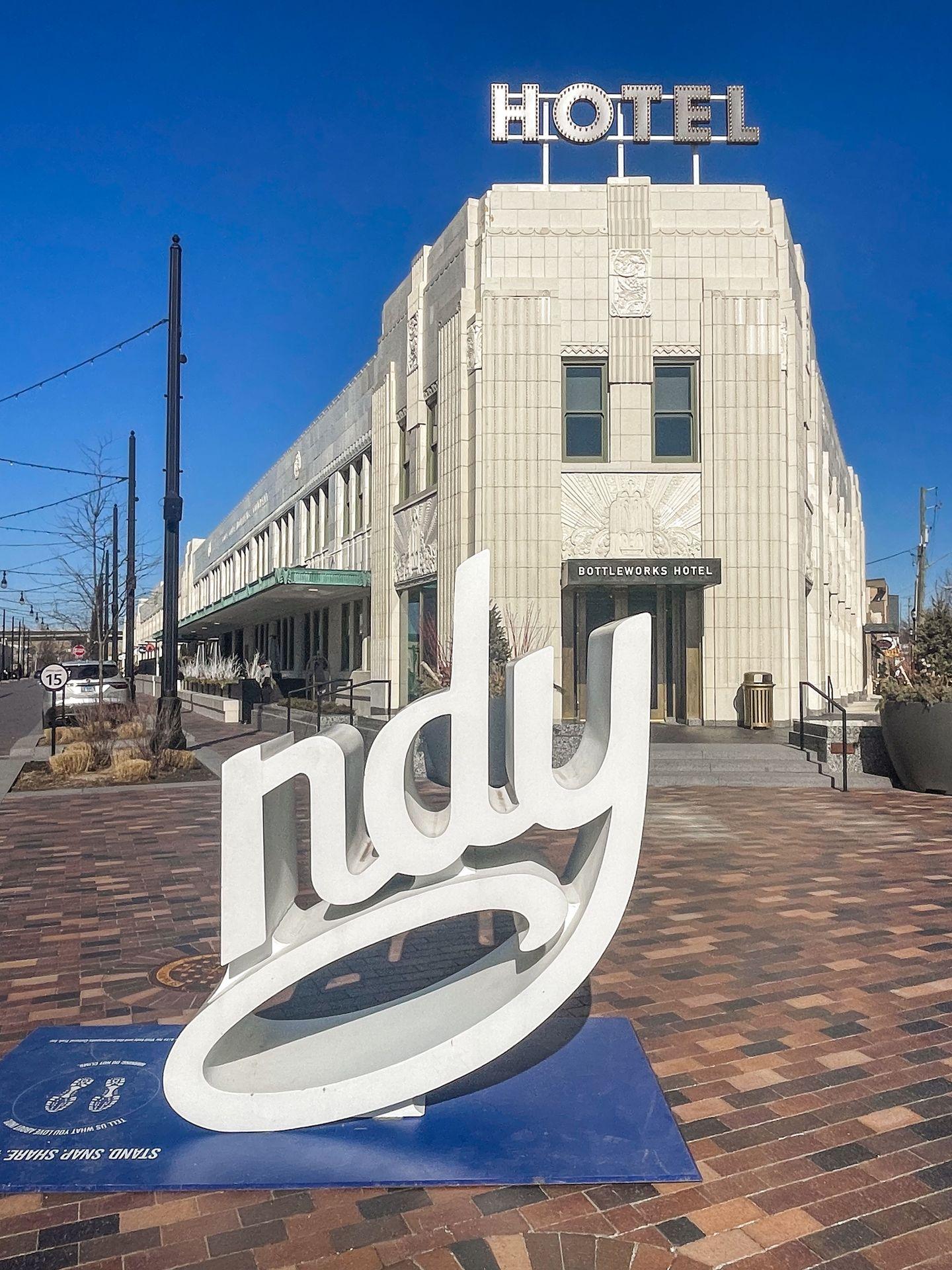 An Indy sign where you can fill in the 'I' in front of The Bottleworks Hotel