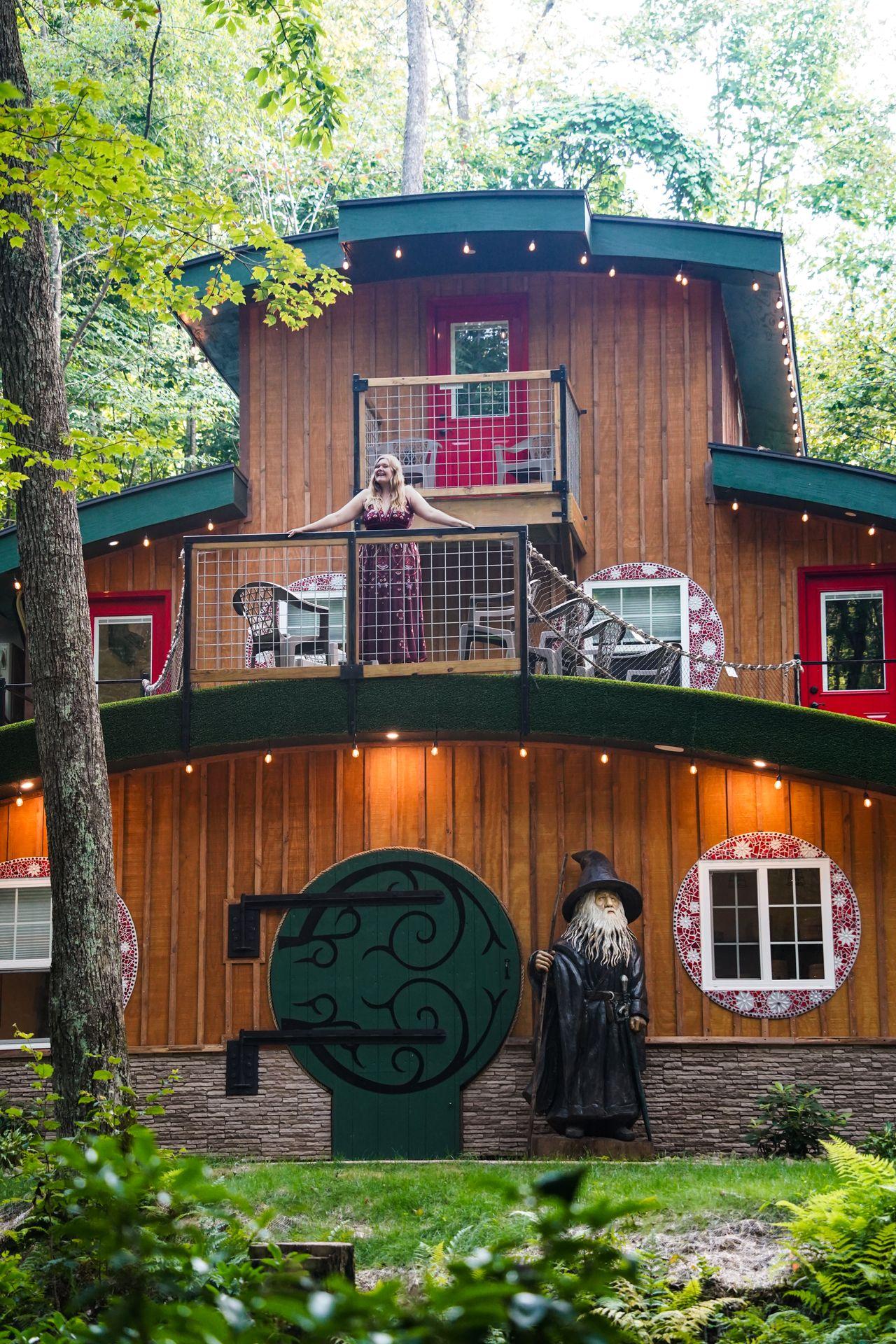 Lydia standing on the 3rd floor balcony at the Ohiopyle Hobbit House.