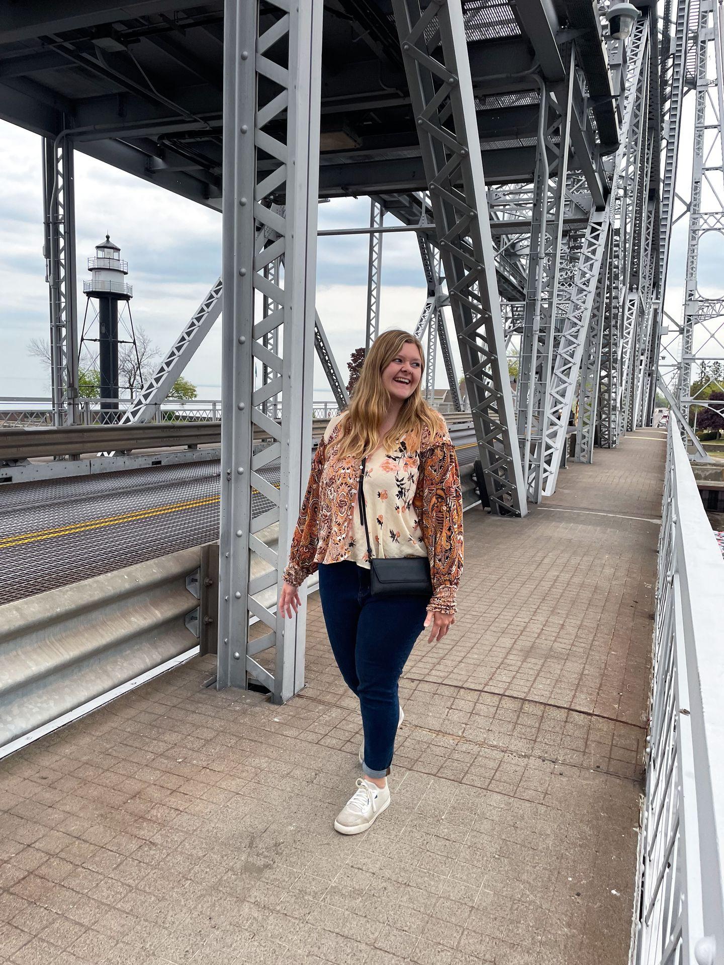 Lydia on the sidewalk of the Aerial Lift Bridge