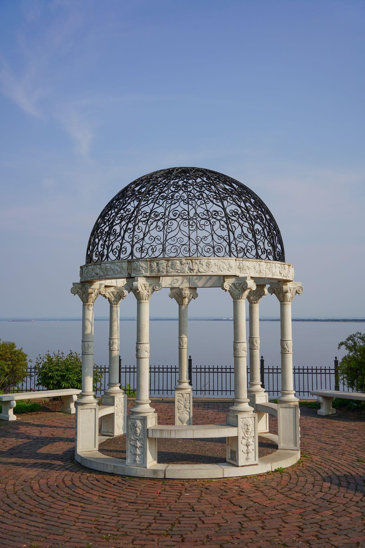 A white gazebo with a black, metal roof at the Duluth Rose Garden