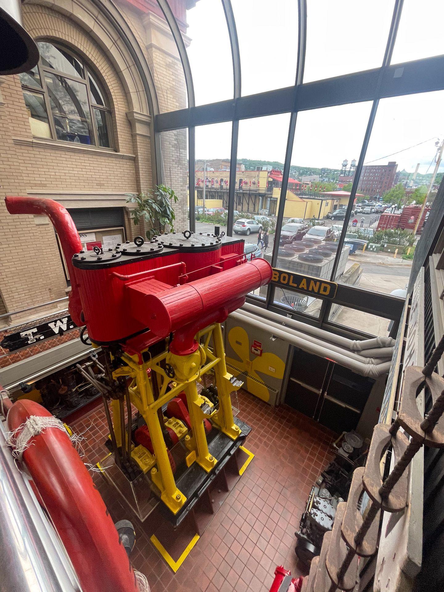 A large engine inside of the Lake Superior Maritime Visitor Center