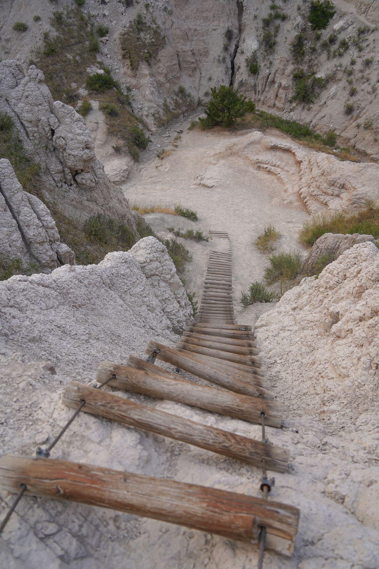 Looking down at a wooden ladder on The Notch Trail at Badlands National Park