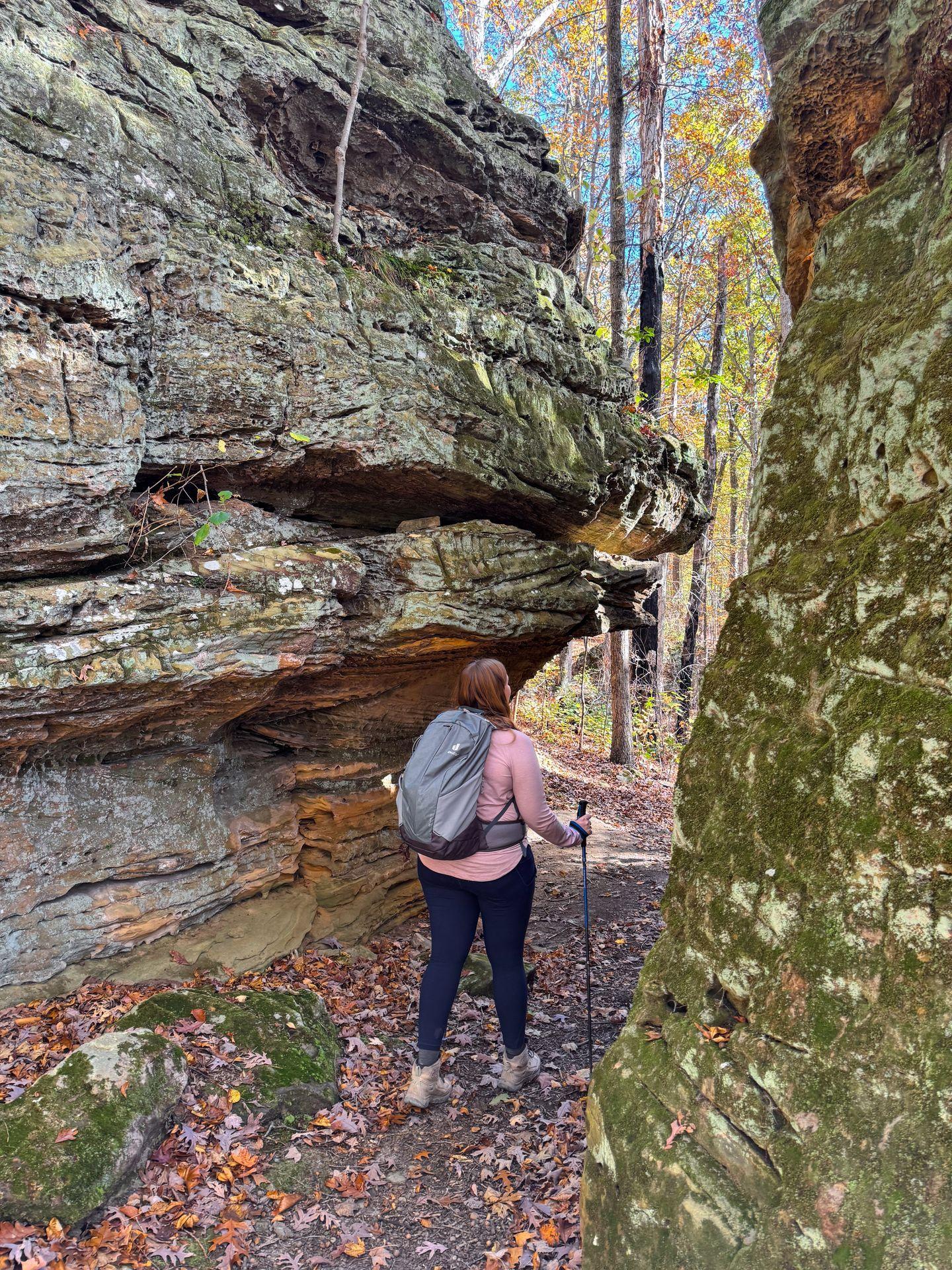 Lydia hiking through some rocks near the Patoka Lake Nature Center