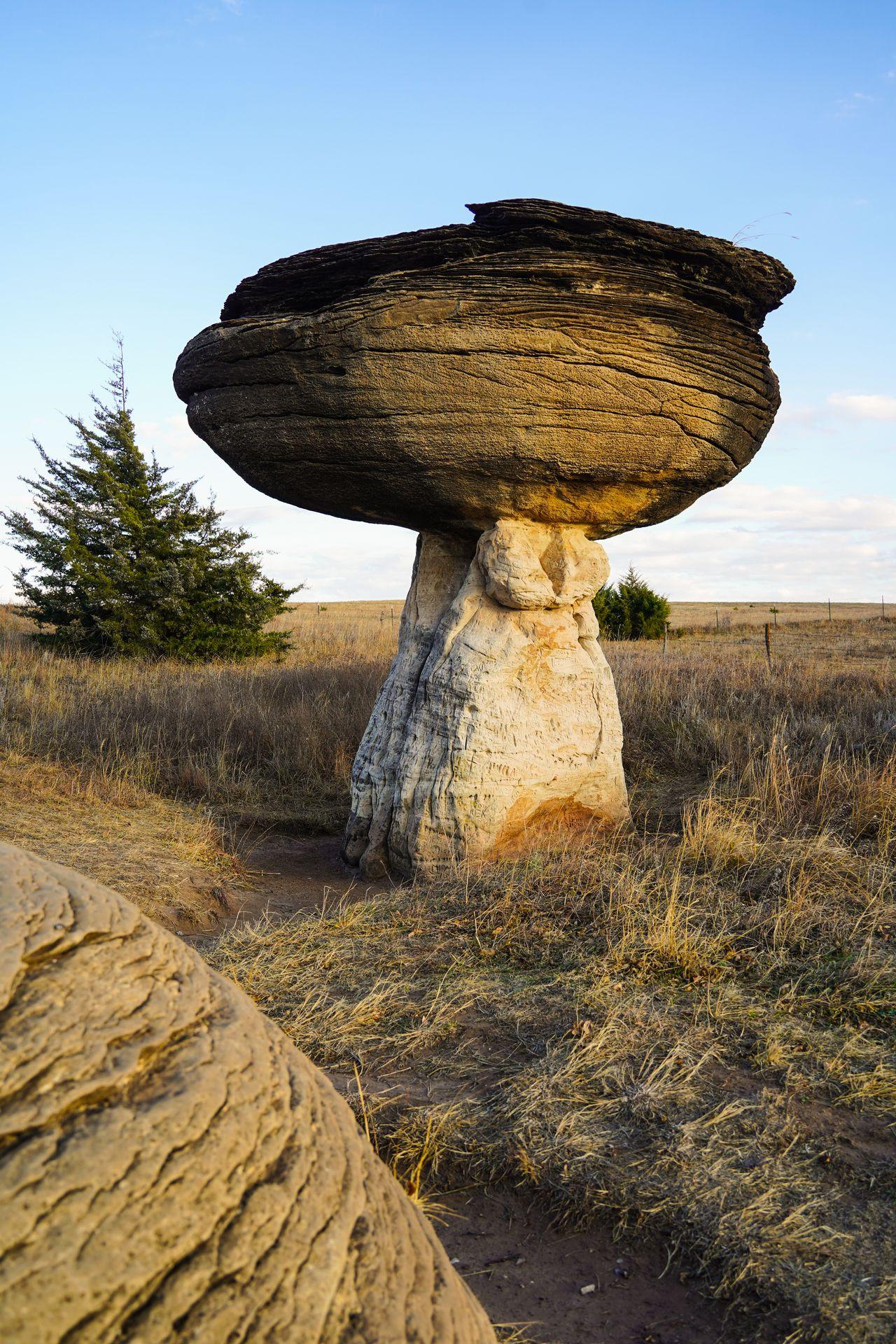 A rock that resembles a giant, round mushroom