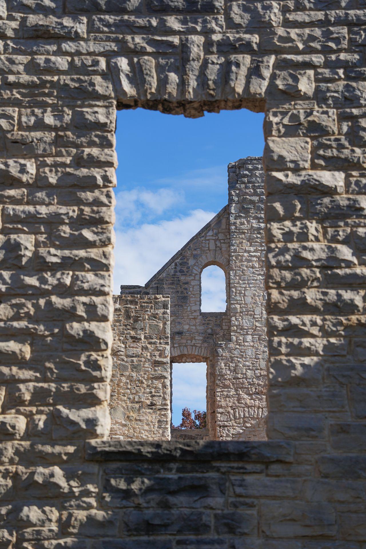 Looking through a stone window at ruins at Ha Ha Tonka State Park