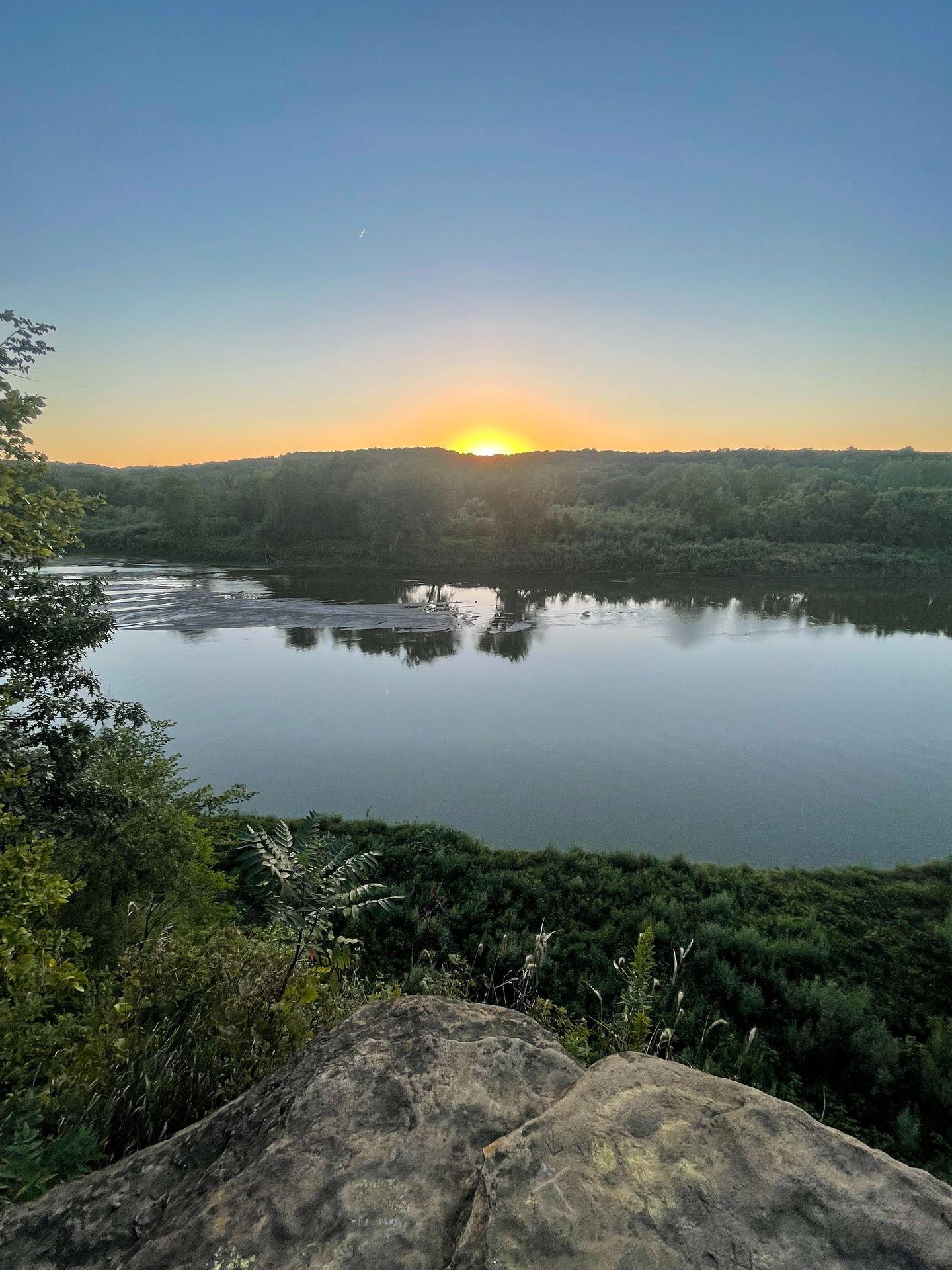 The sun setting over the river at Ledges State Park