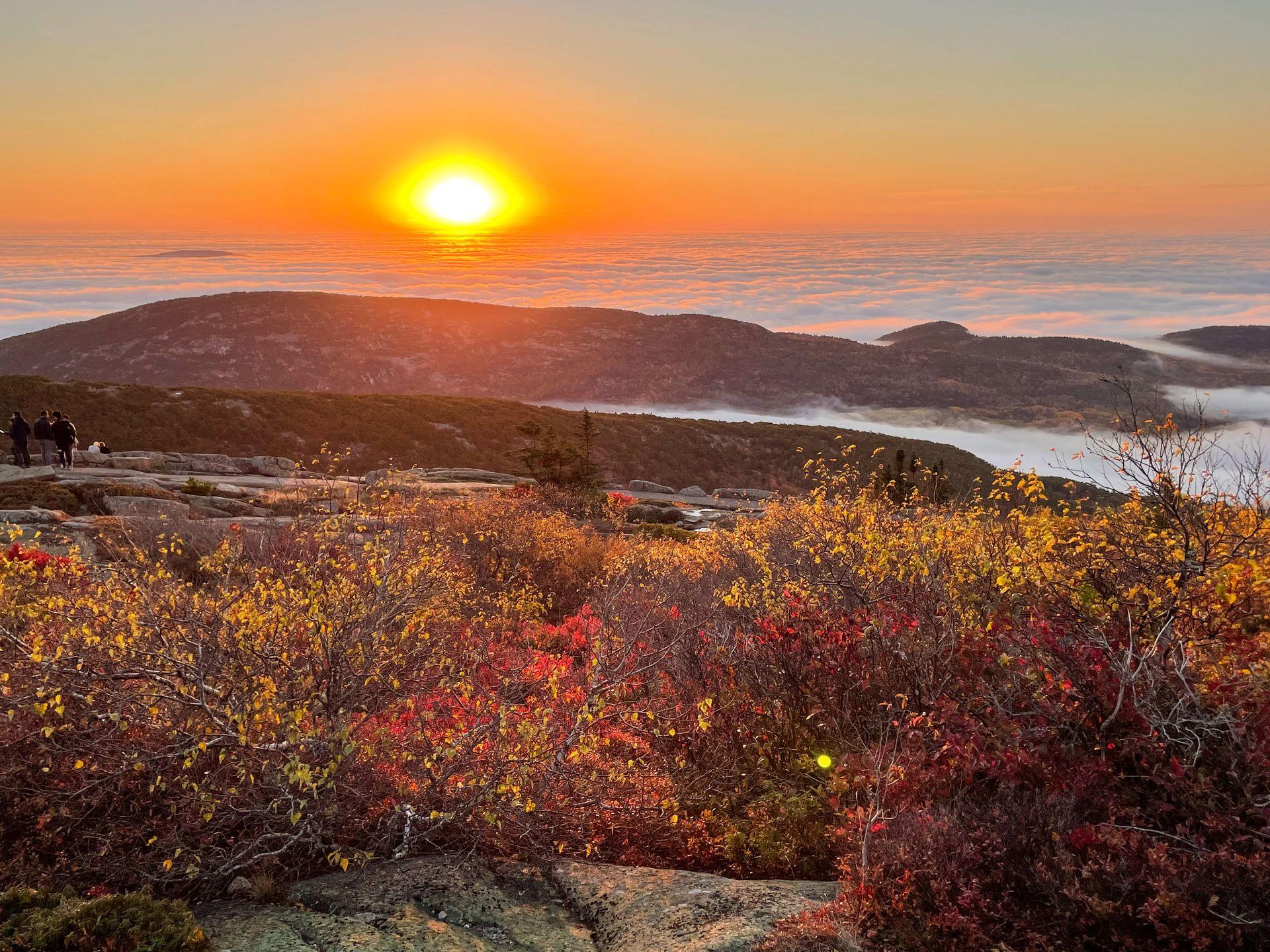 A view of the sunrise from Cadillac Mountain with a cloud inversion.