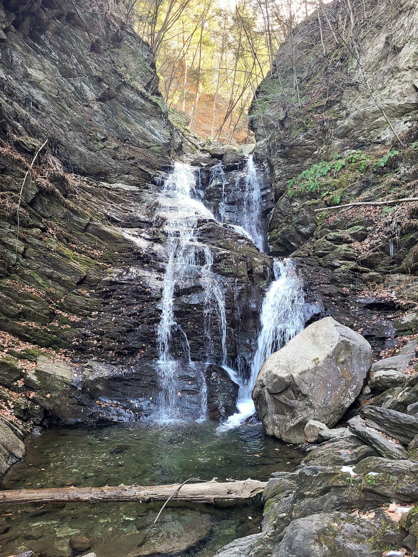 A waterfall falling down a rock face