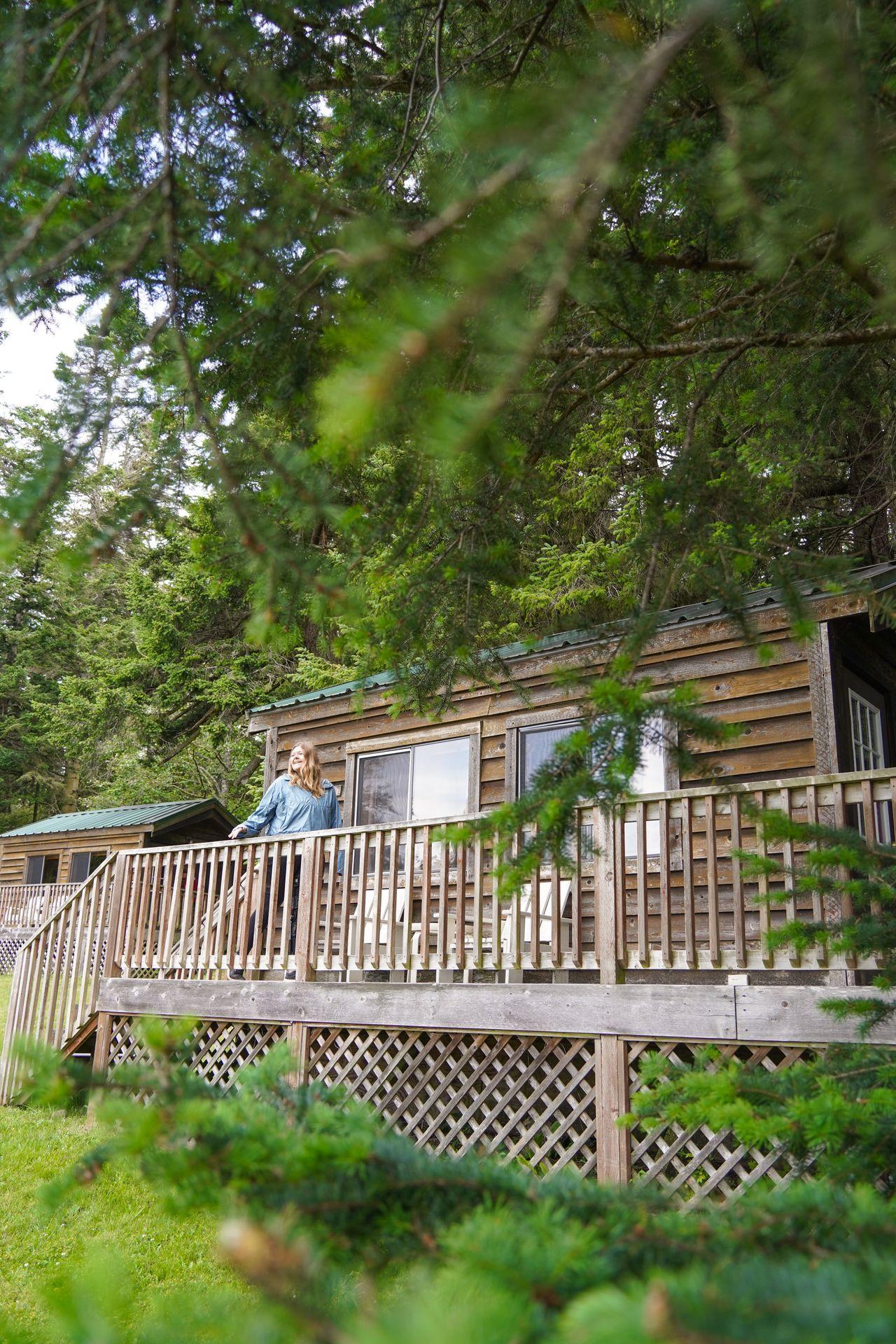 Lydia standing on the porch of a cabin at Doe Bay Resort