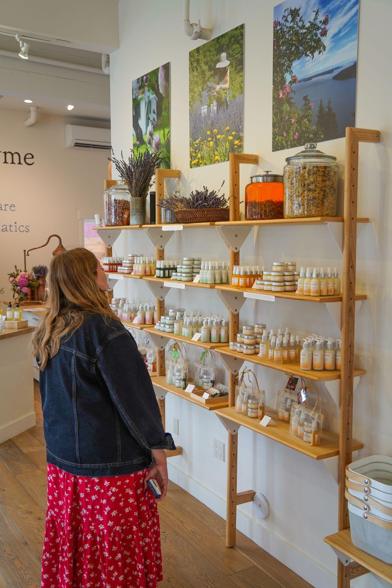 Looking looking at shelves with lotions, sprays and more in Island Thyme Botanicals