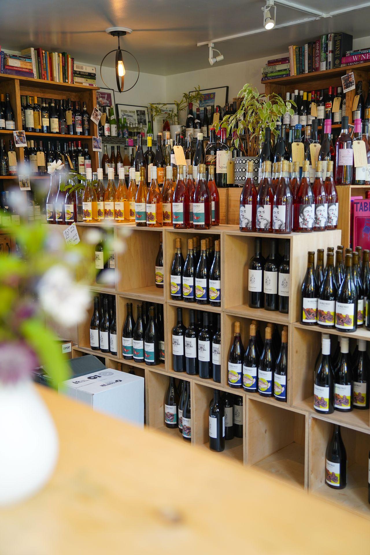 Looking at shelves full of wine bottles at Doe Bay Wine Company