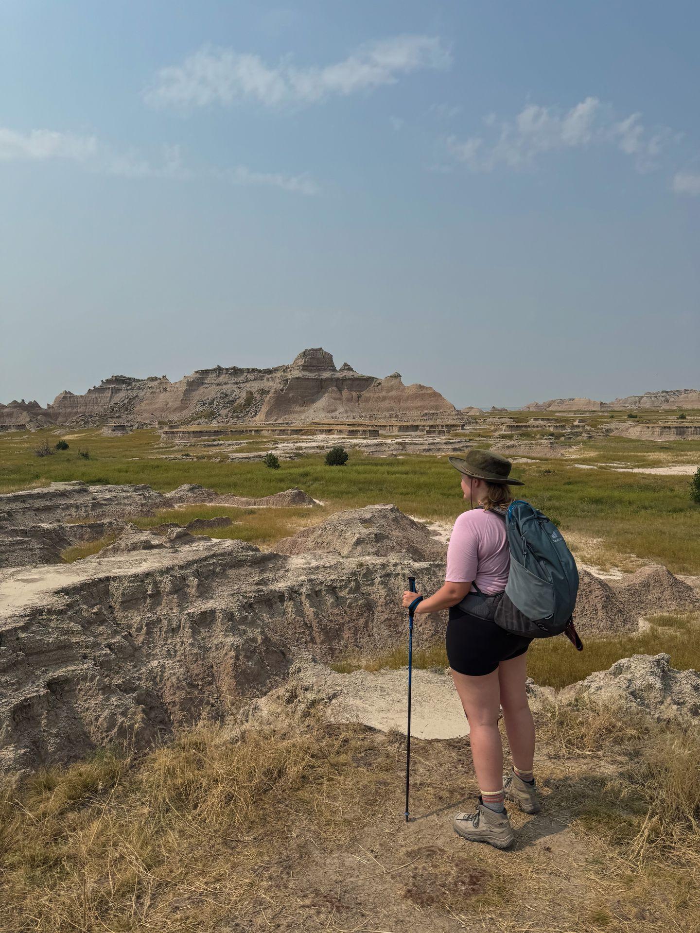 Lydia admiring the views of rocks and greenery on the Castle Rock Trail