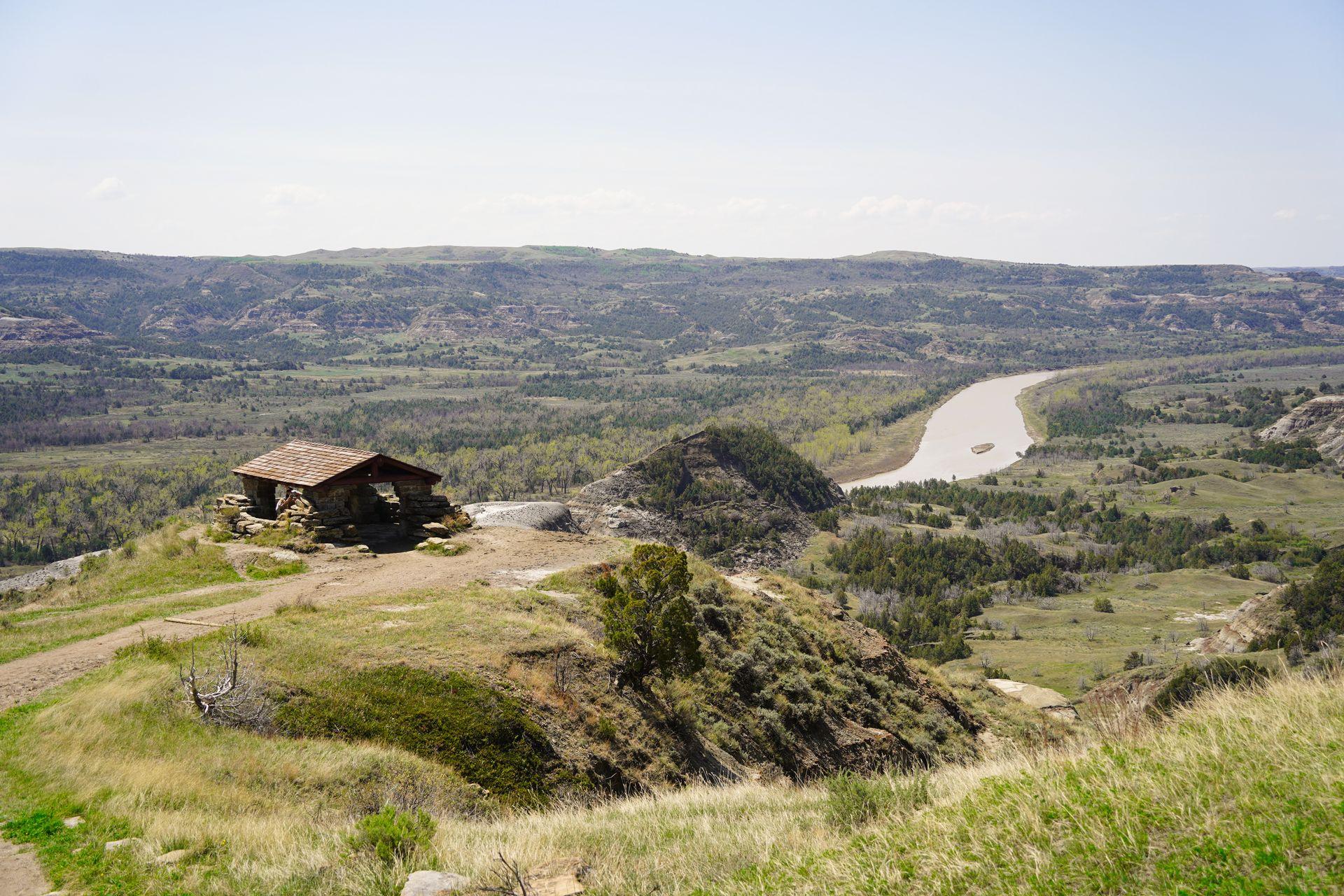 A shelter on an overlook above a bend in the river