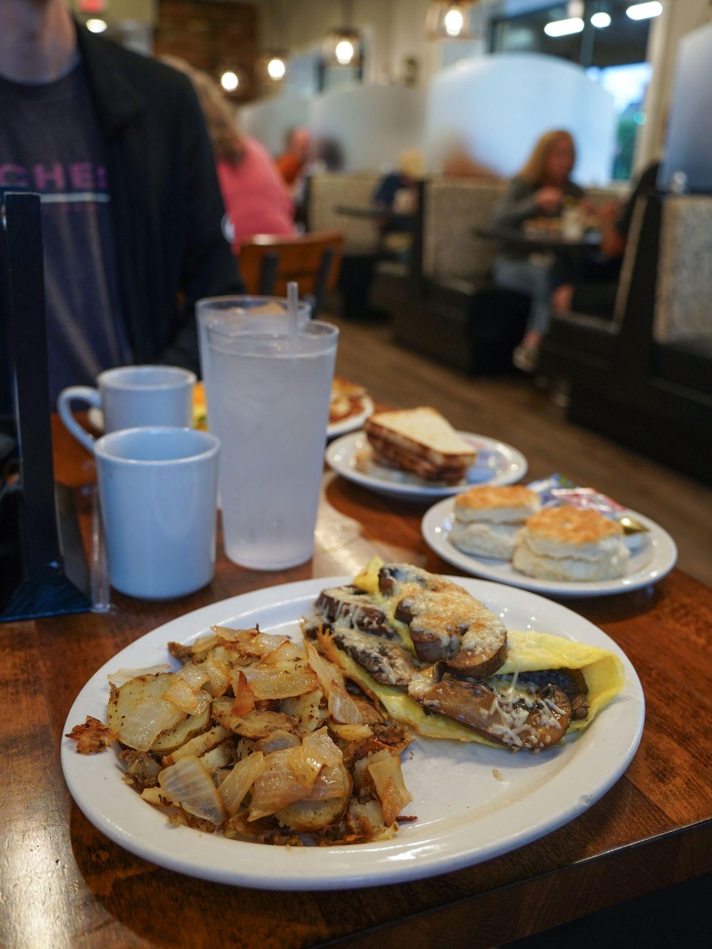 A plate with an omelette and potatoes from The Breakfast Club