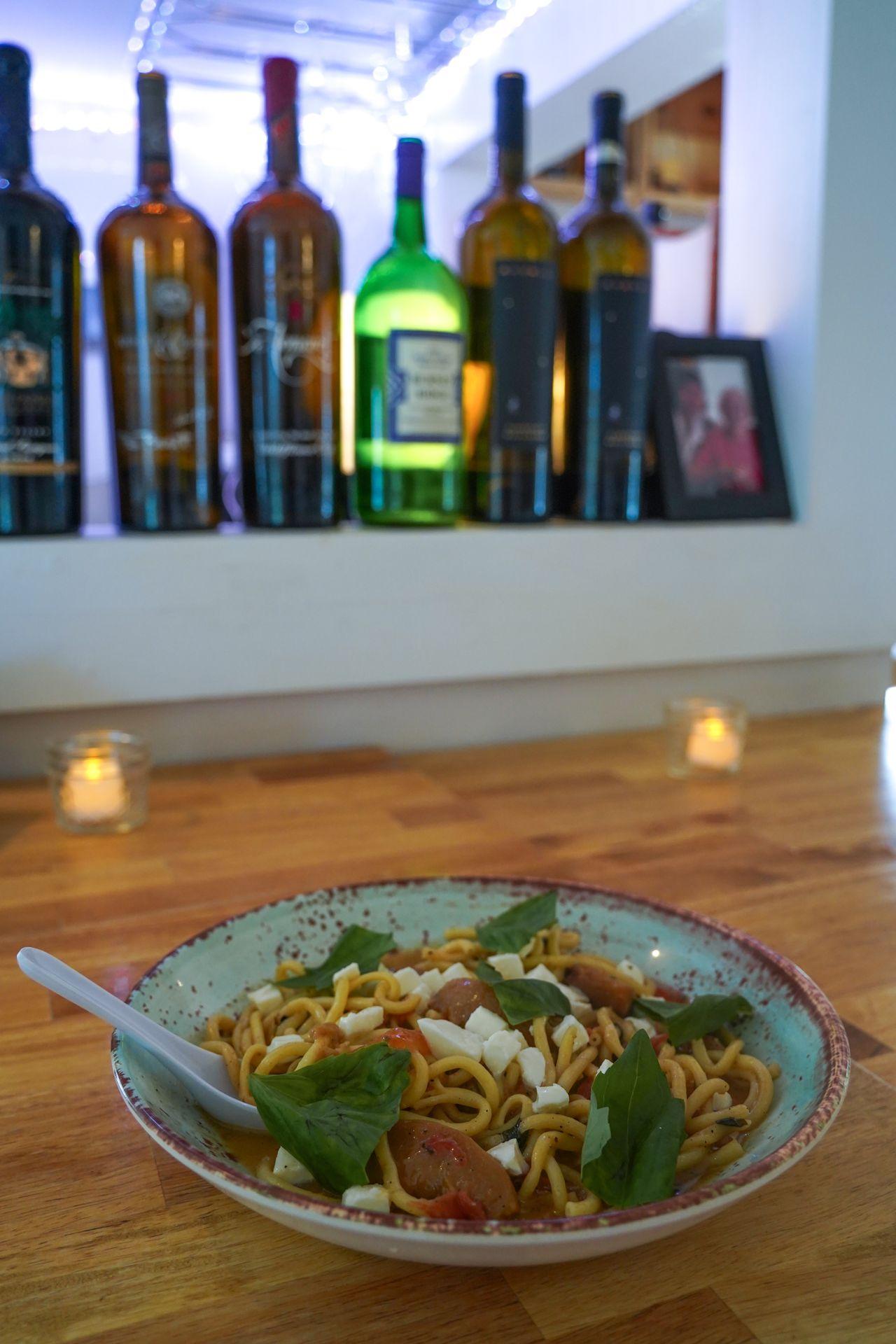 A bowl of pasta with tomatoes, basil and mozzarella from Wildflower Cafe