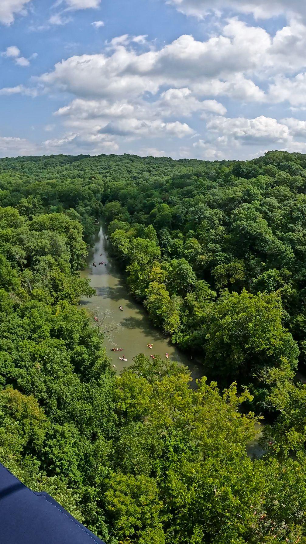 A view of the Little Miami River from above. Several kayaks are on the water