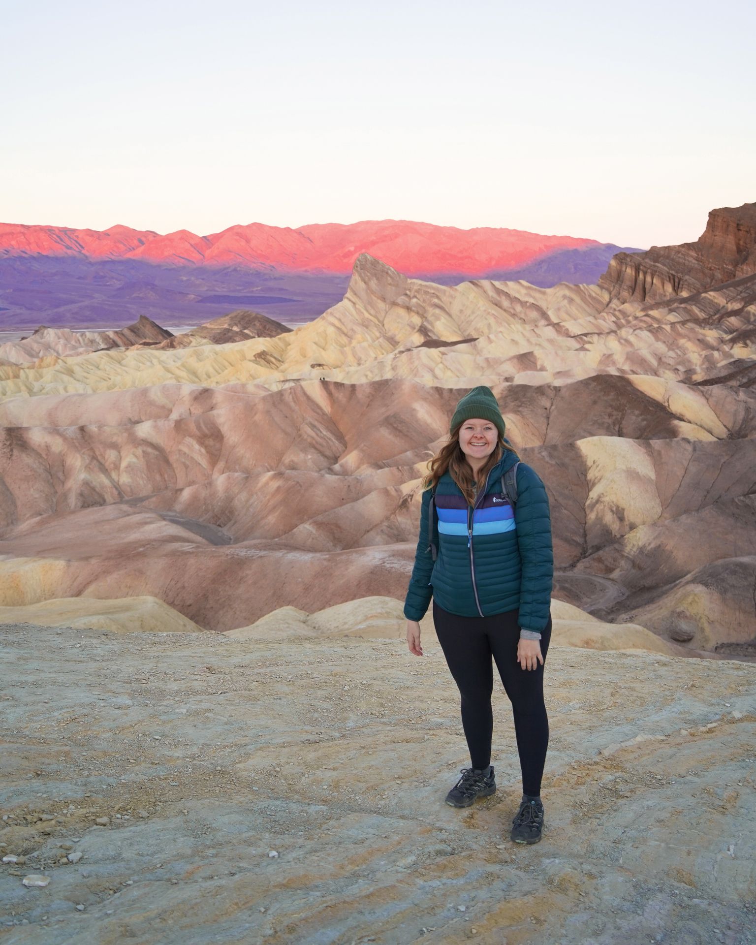 Lydia standing at Zabriskie Point at sunrise.