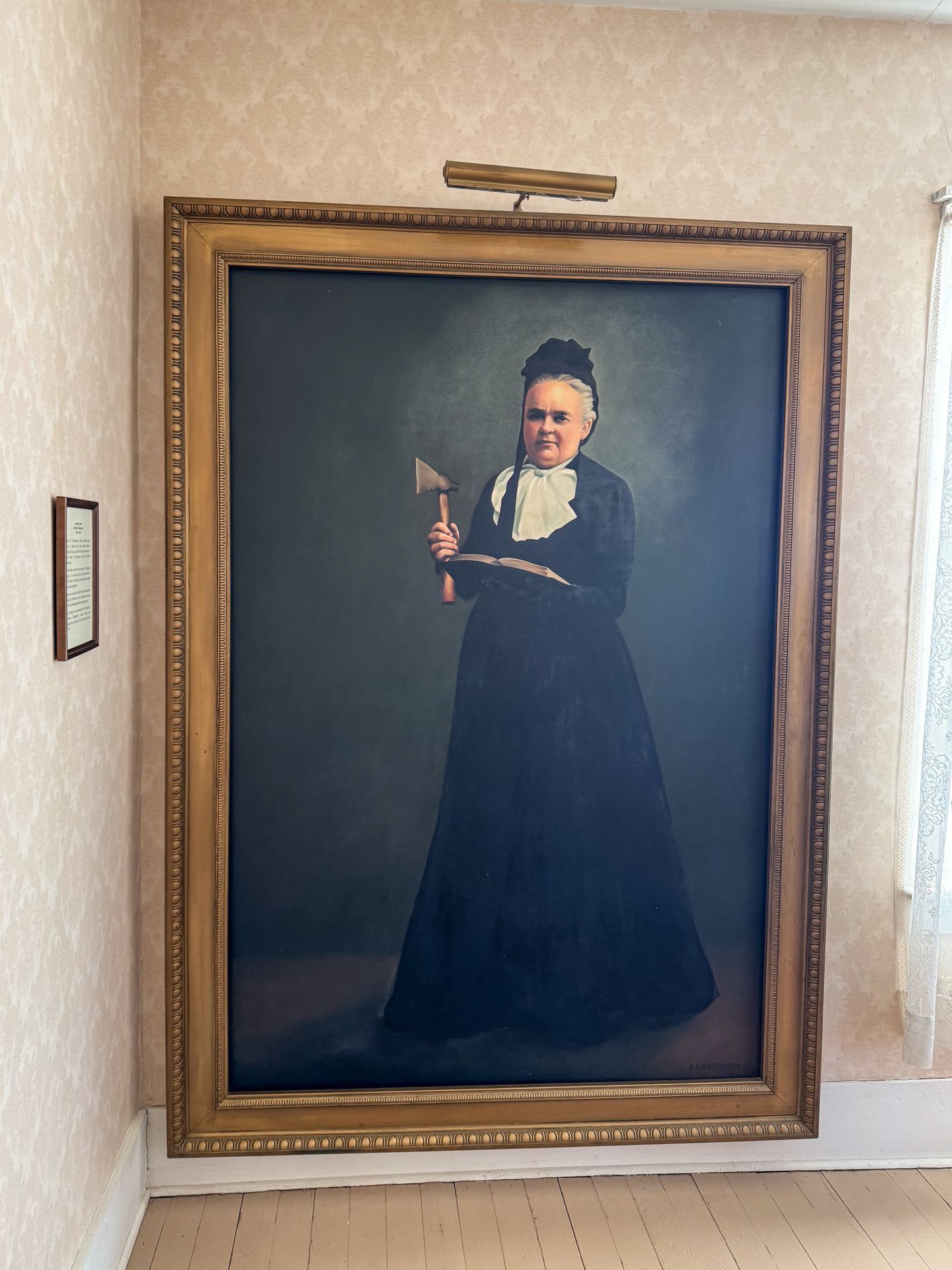 A huge painting of Carry A. Nation inside her former home
