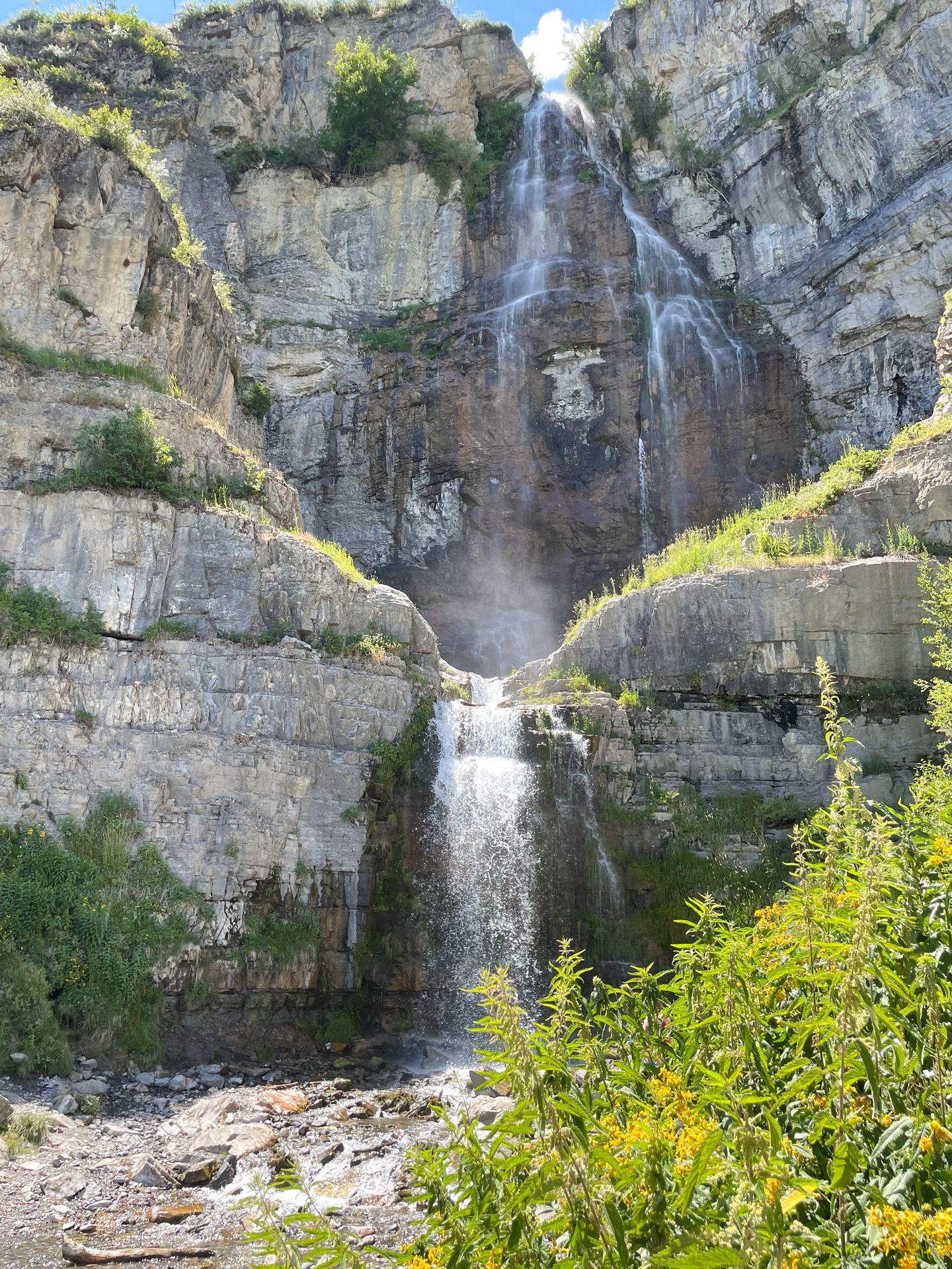 A tall waterfall with two tiers
