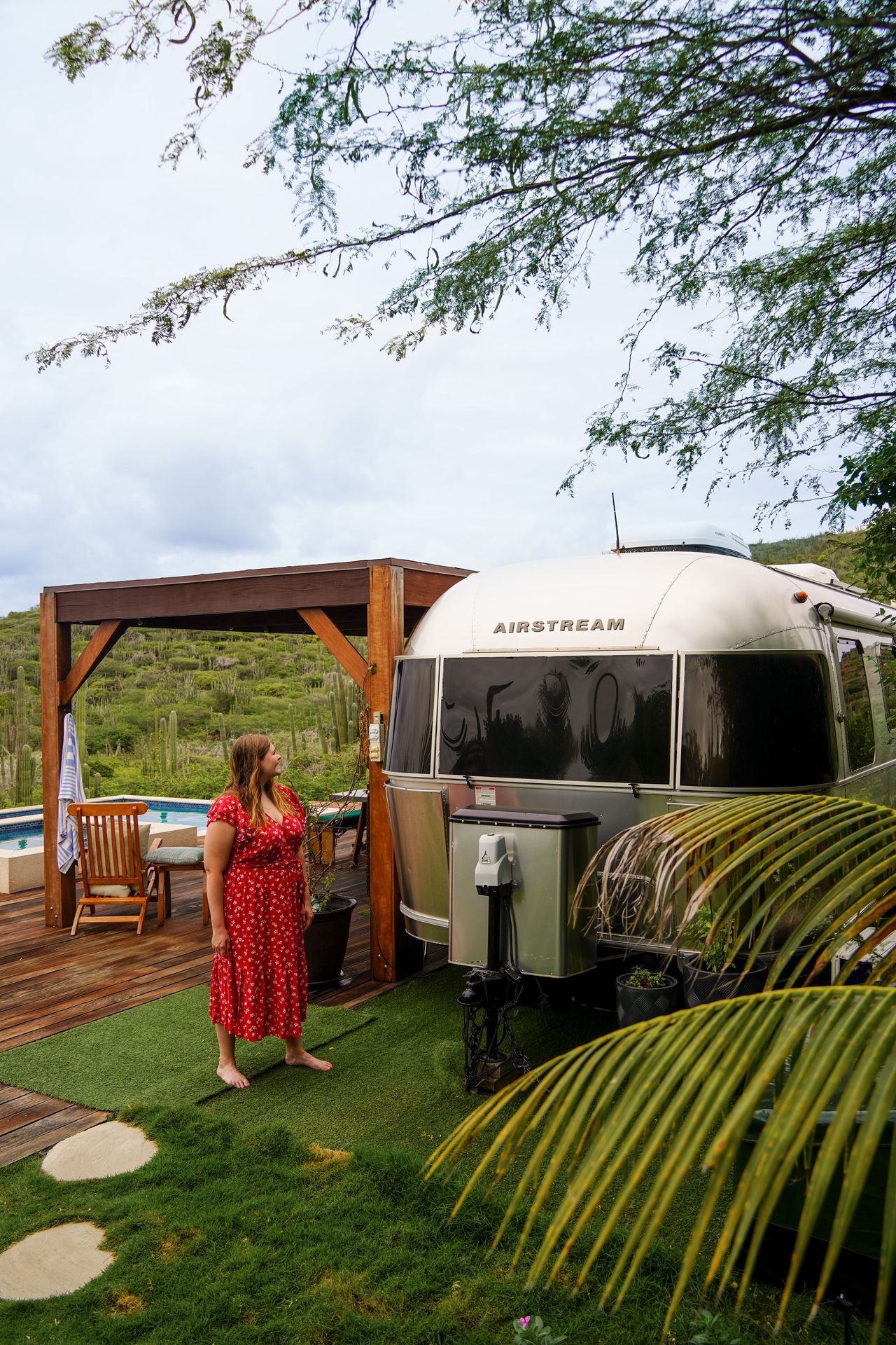 Lydia standing next to the Aruba Airstream