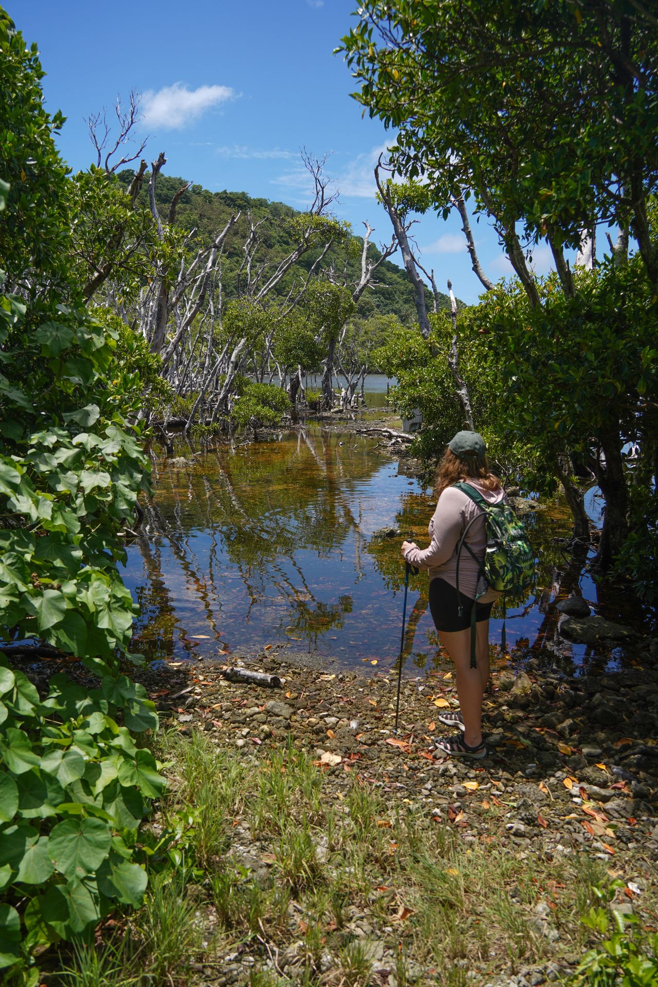 Lydia standing next to a lake on Aunu'u Island