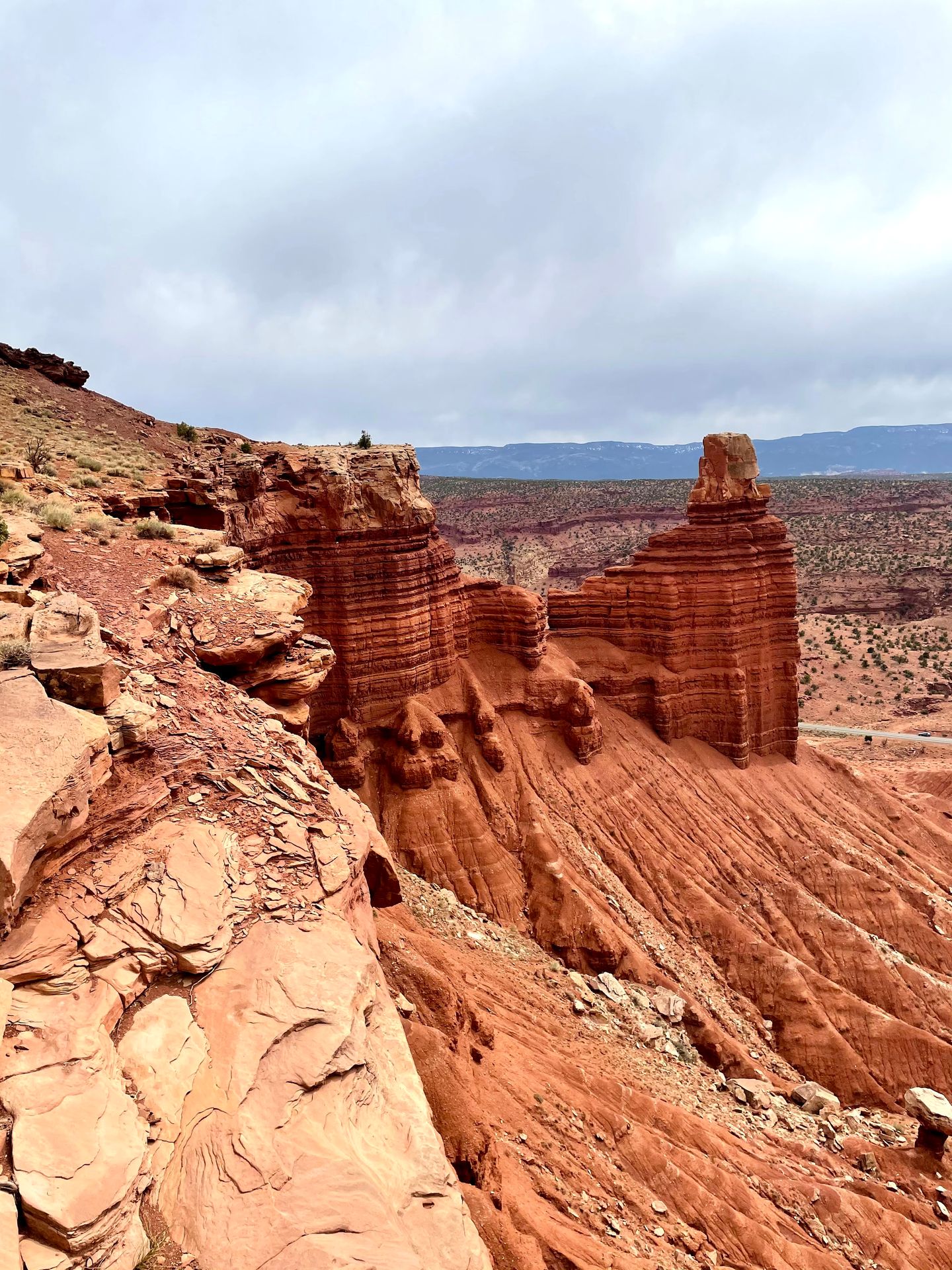 A tall, orange rock formation called Chimney Rock, inside of Capitol Reef National Park.