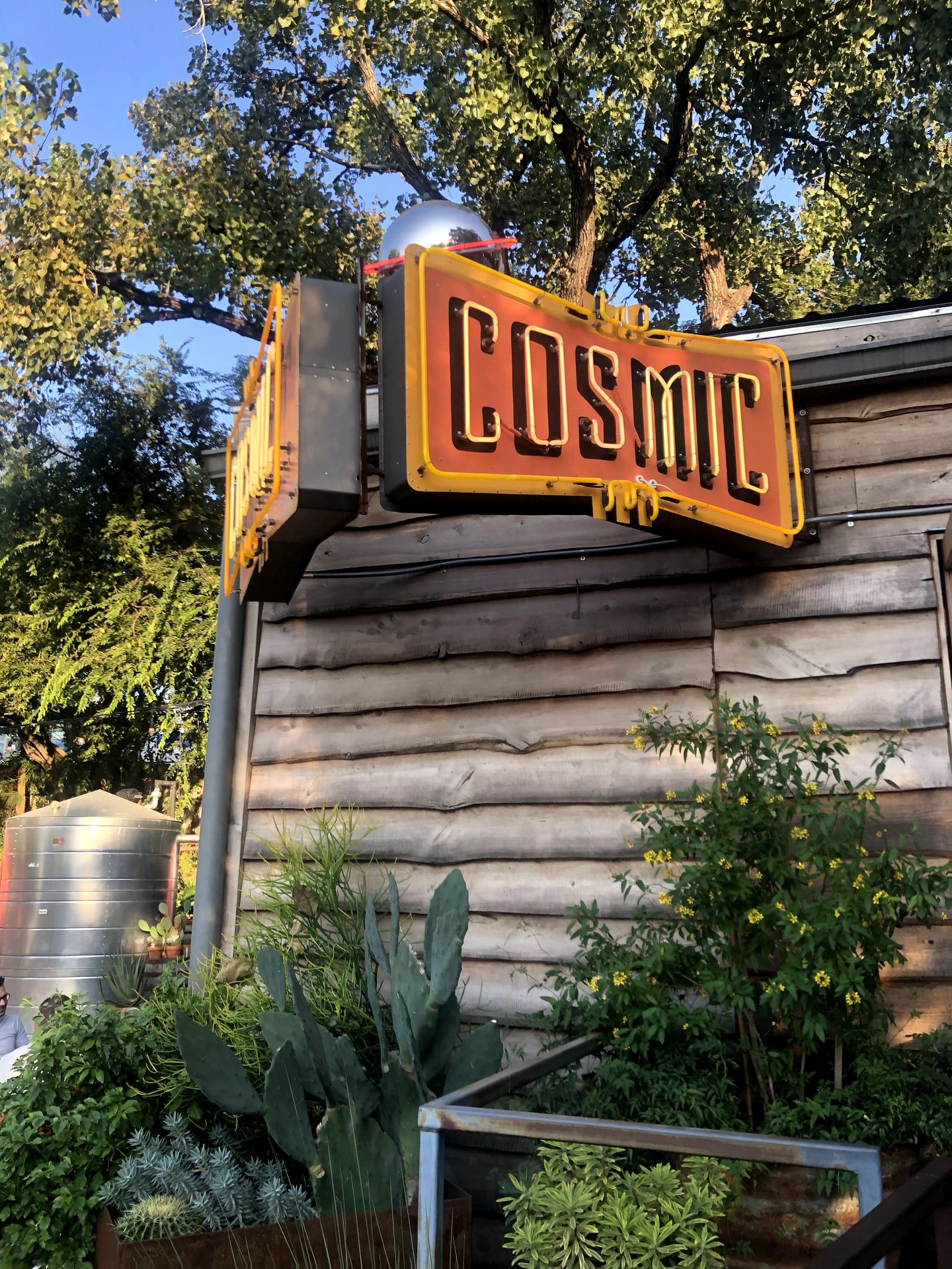The bright sign for Cosmic Coffee and Beer.