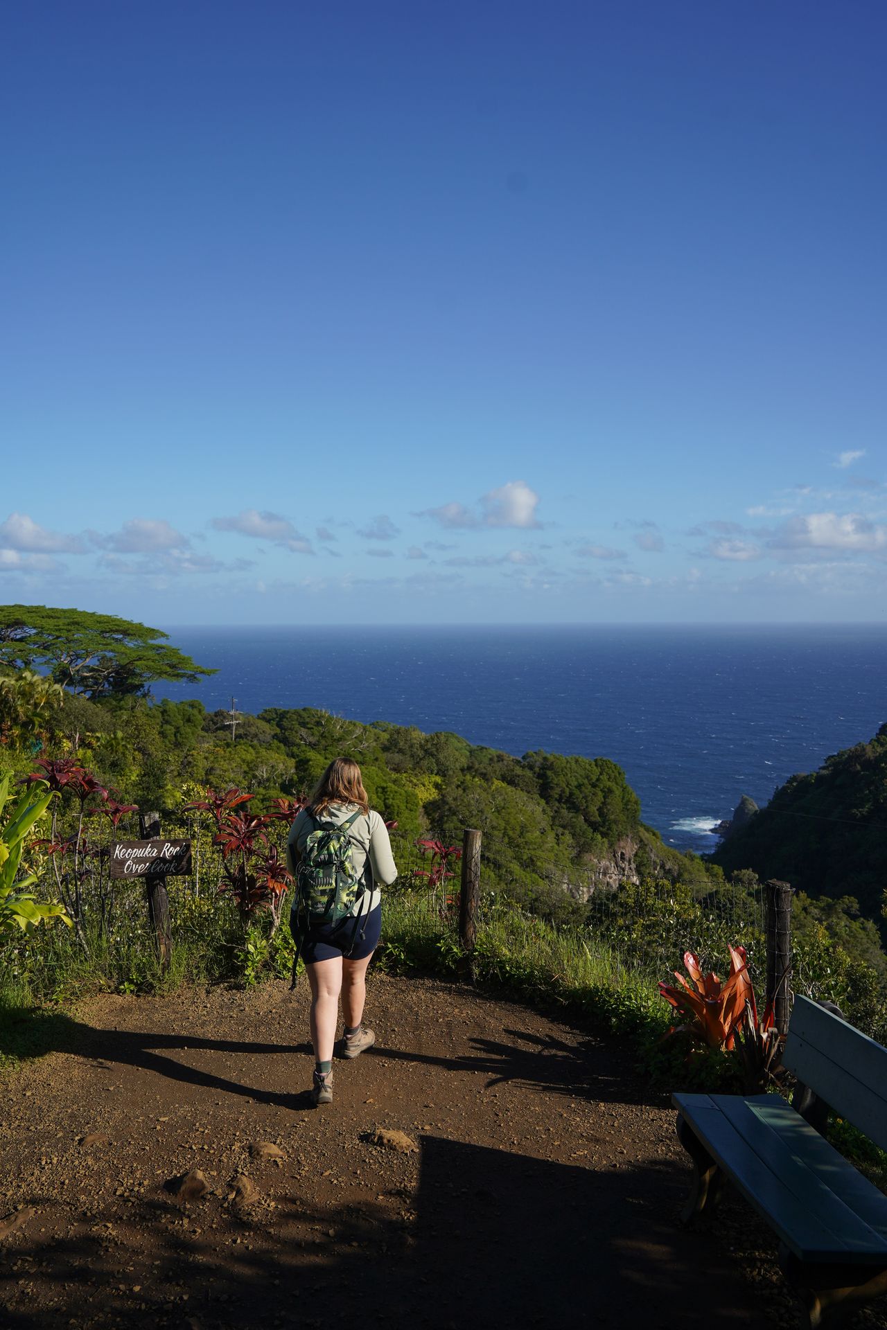 Lydia walking to a viewpoint of the coast in the Garden of Eden Arboretum