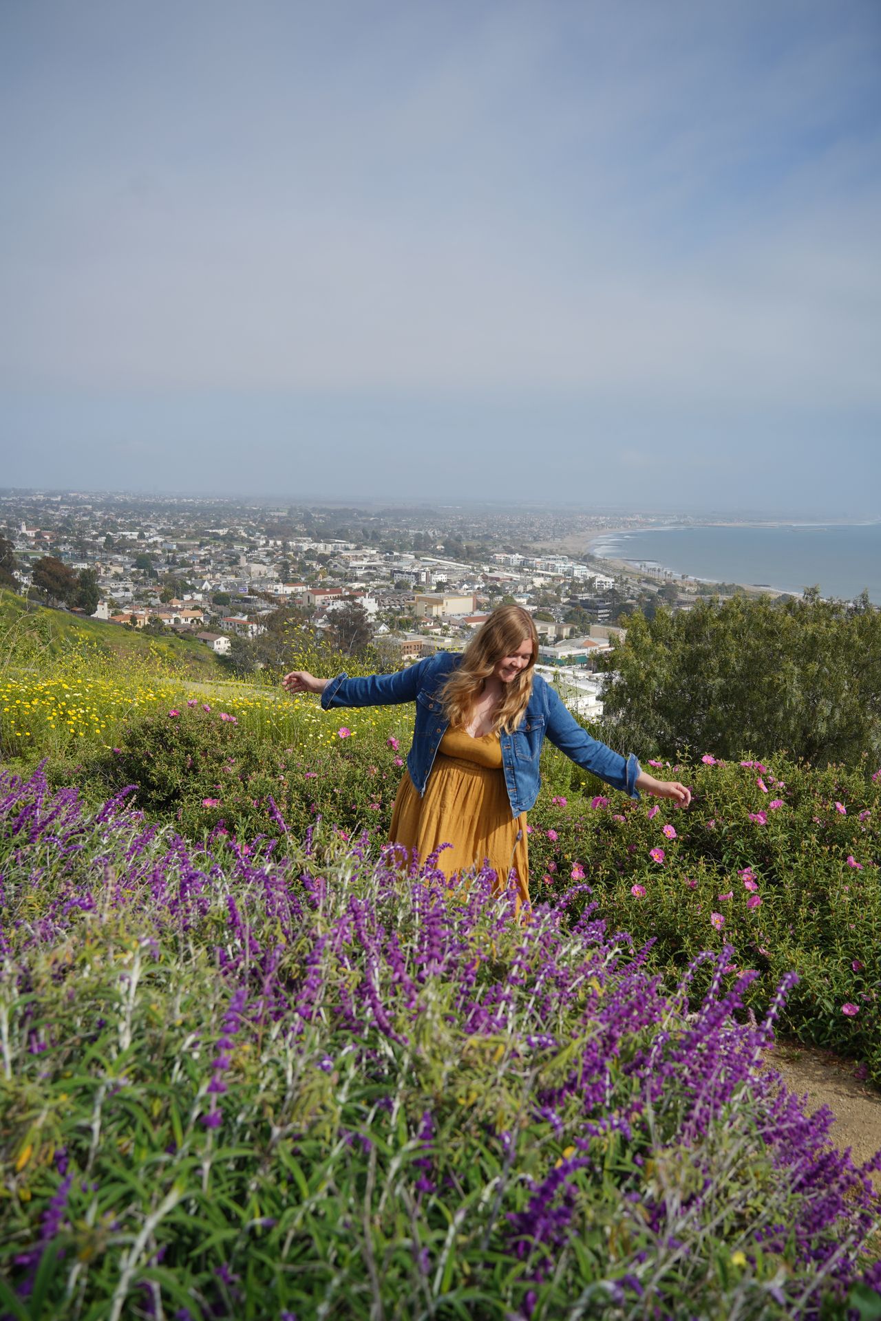 Lydia posing among flowers at Serra Cross Park