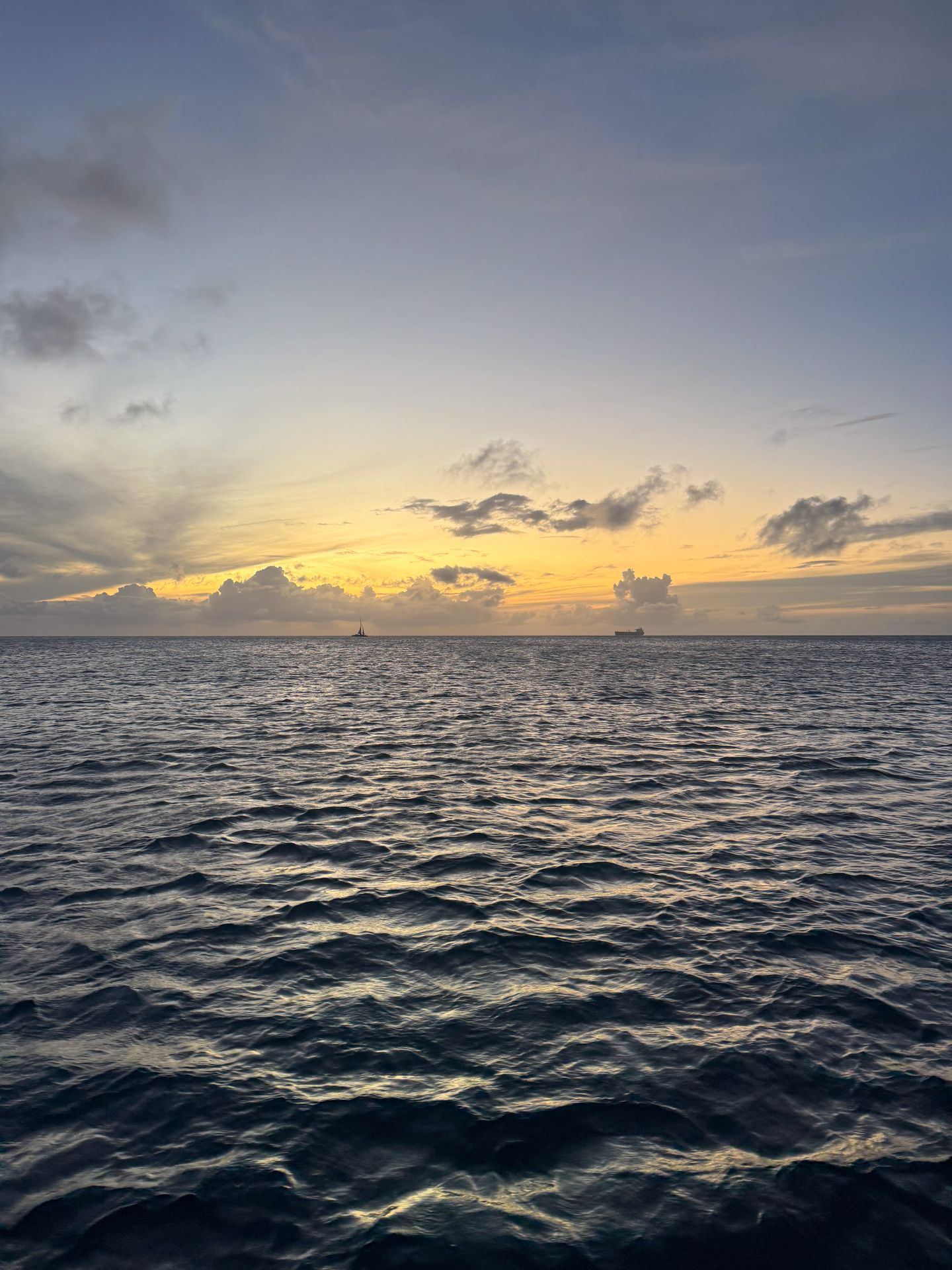 The sun setting over the ocean