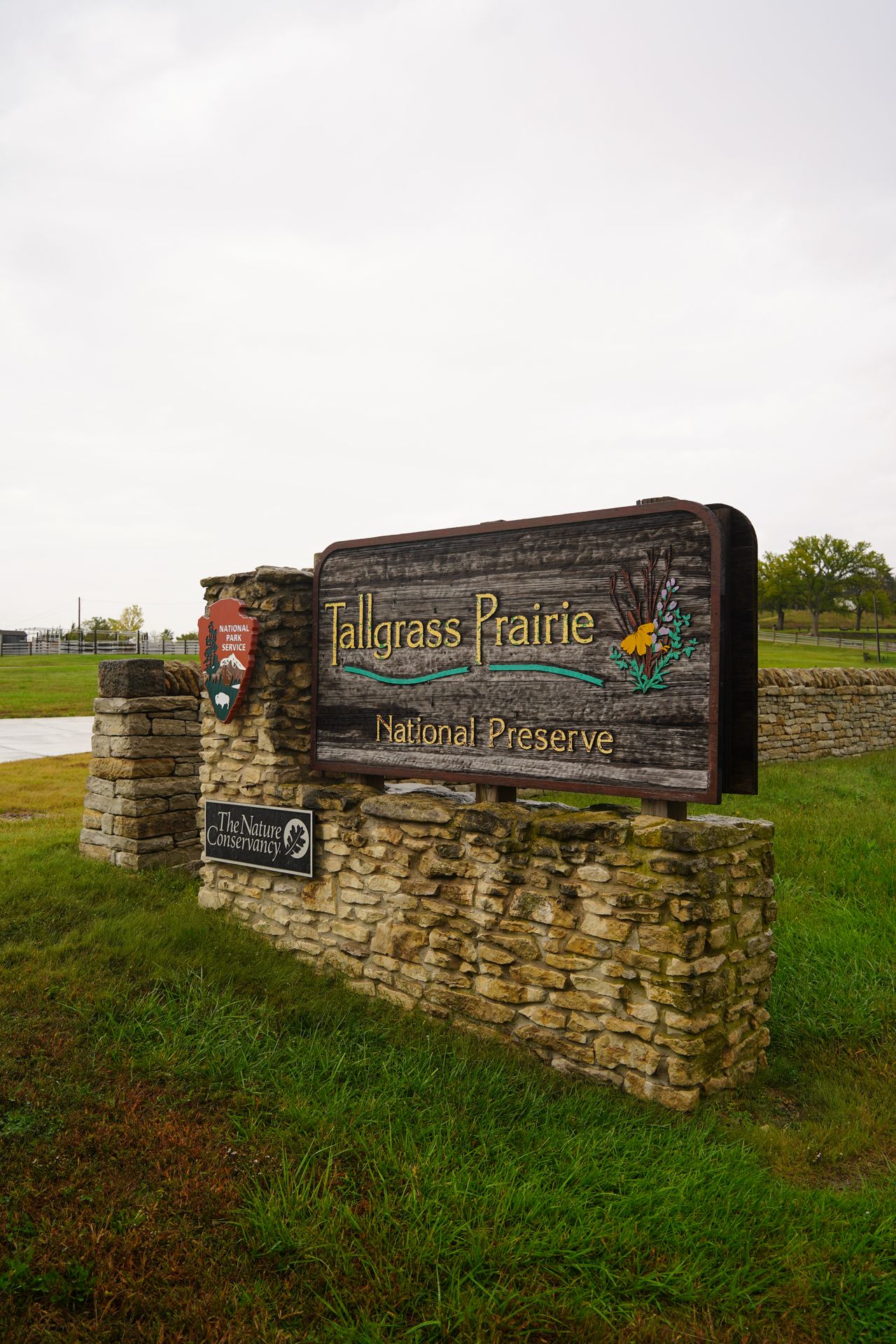 The sign for Tallgrass Prairie National Preserve, which has some flowers on it