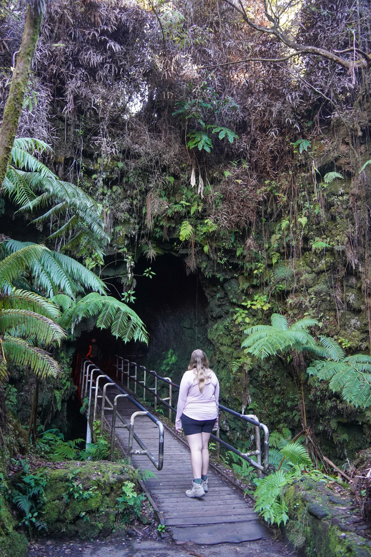 Lydia standing in front of the entrace to the Nāhuku lava tube