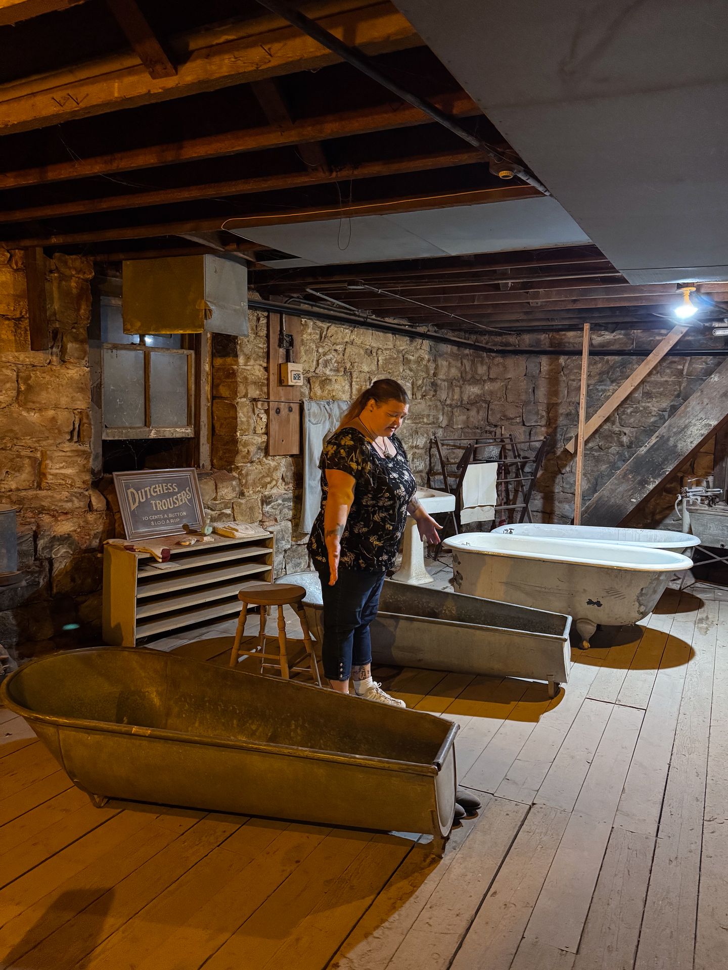 A guide telling stories about the bathhouse in the underground tunnels of Ellinwood